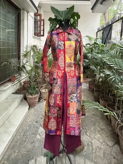For this outfit, we created a long, A-line front-open kurta with pants, offering a chic and elegant look.