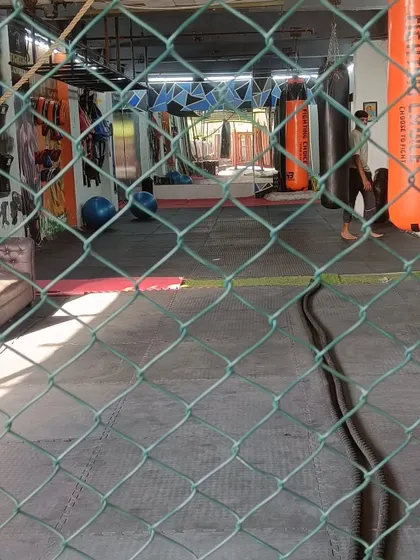 A view through the cage at our Greater Noida club. The facility is designed to provide a professional training environment.