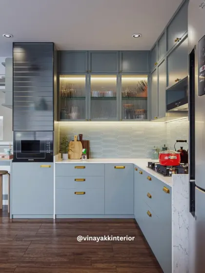 The heart of the home deserves to be both beautiful and functional. We designed this modular kitchen with calming powder-blue cabinets, warm under-cabinet lighting, and smart storage solutions to make daily routines feel effortless and stylish.