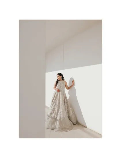 A minimalist and modern bridal portrait of Roha in Dubai, using clean lines and strong shadows to create a high fashion look.