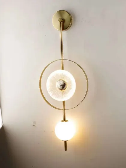 A variation of our geometric wall sconce, shown here in a vertical orientation. It's a versatile piece for modern interiors.