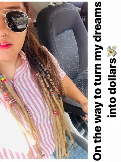 I live the loc life myself. This is me with my own partial dreadlock extensions, styled with colorful beads. I believe in my work, and I love creating styles that are both beautiful and easy to wear every day.