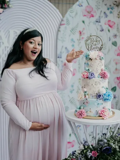 A proud baker moment with my baby shower cake. It's always extra special when I get to create something for my own family's milestones.