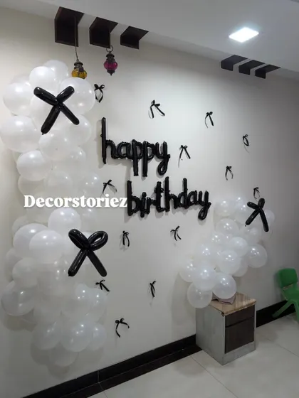 Another view of the modern black and white balloon wall decor, showing how it can effectively decorate a corner space.