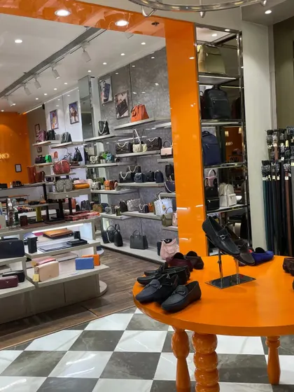The interior of the Da Milano section, with its bright orange display table and well-stocked shelves.