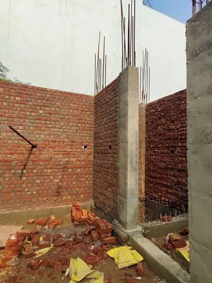 A site visit to an ongoing residential project. This is the foundation and brickwork stage for a 150 sq. yard plot.