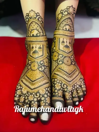 A beautiful foot design featuring elephants and jhumkis, with delicate floral patterns filling the rest of the space.