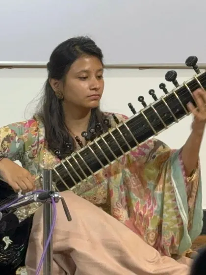 A student performing on stage, demonstrating the skills she has developed through our taleem sessions. Every student gets the opportunity to perform.