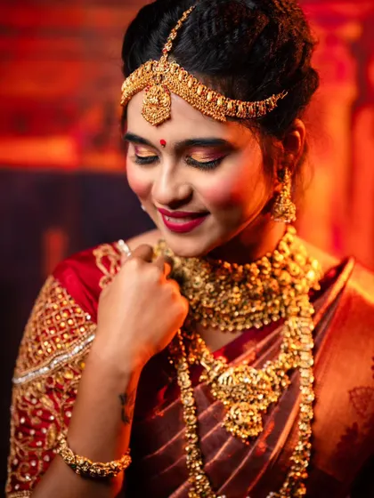 A detailed shot of the matha patti and choker from one of our popular bridal rental sets. The craftsmanship gives the look of real gold without the expense.