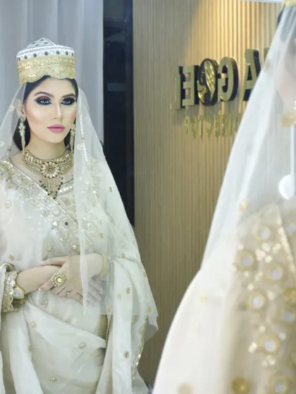 An elegant Muslim bridal look, featuring a white and gold outfit with dramatic eye makeup. Our courses cover diverse cultural traditions to prepare our students for a wide range of clients.