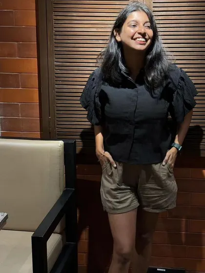 A casual cafe look in Bangalore. I paired this black puff-sleeve top with simple khaki shorts for a comfortable and stylish outing.