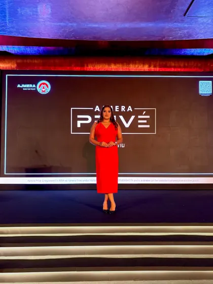The stage is my comfort zone. Here I am at the Ajmera Privé launch, ready for the show to begin.
