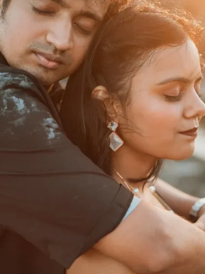 A tender embrace captured during a golden hour pre-wedding shoot in Goa. The warm light and close connection make this a timeless and romantic portrait.