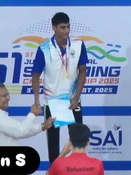Dhakshan S receiving his gold medal for the 400m Freestyle.