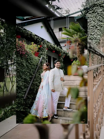 A stylish portrait of the couple on the steps, with the lush greenery of Nainital in the background.