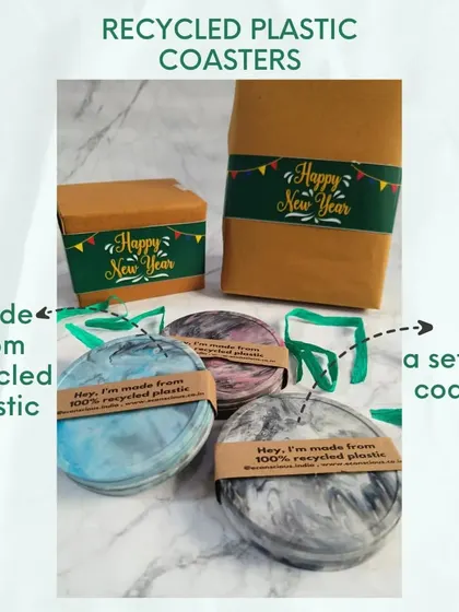 These coasters, made from recycled plastic, are a key component of our gift hampers. They come in sets of four, each with a unique marble pattern, making them a practical and beautiful eco-gift.