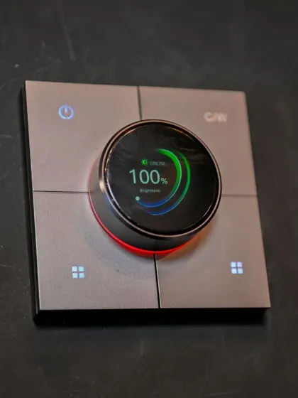 A close-up of my rotary knob switch, a highlight at the Smart Home Expo. This device combines a digital display with a physical dial, showing brightness levels and offering a modern yet intuitive control experience.