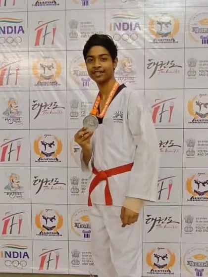 Varun Das proudly displays his silver medal. A great achievement at the national level.