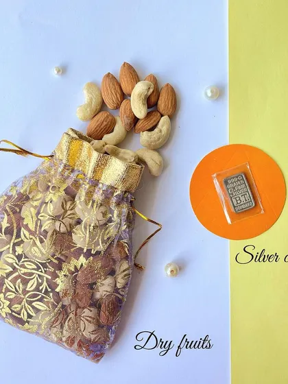 We also include a potli of assorted dry fruits and a small silver coin for good luck in our Diwali hamper.