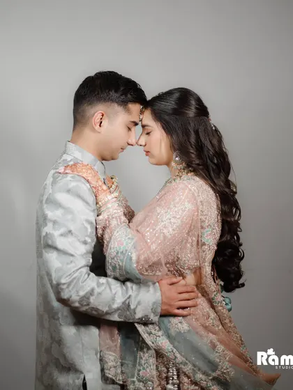 A deeply romantic and intimate close-up portrait. The soft lighting and the couple's foreheads touching create a powerful image that speaks of trust, love, and a shared future.