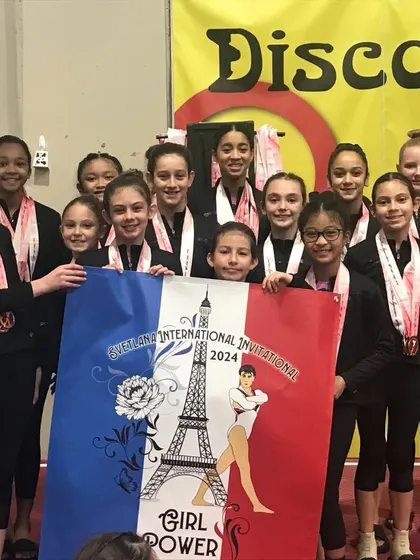 Our Xcel Gold team celebrates their 2nd place team award at the Svetlana Invitational.