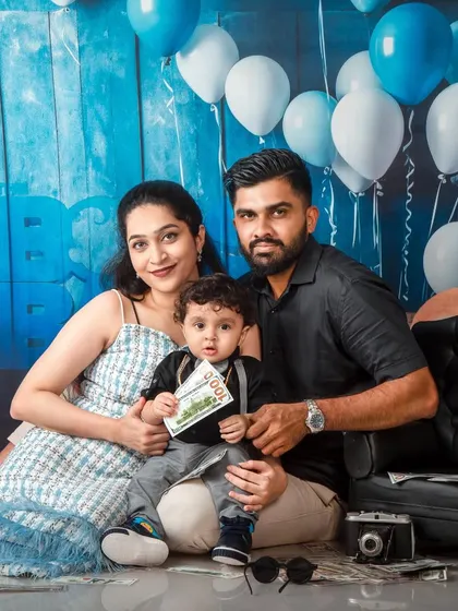 Family portraits are an important part of my themed photoshoots. Here, the family joins their little 'Boss Baby' for a perfectly coordinated and loving family picture.