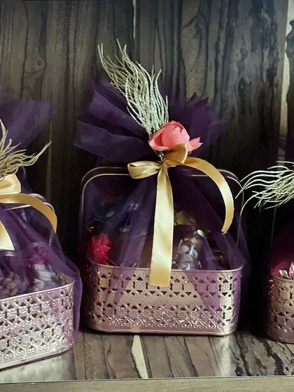 Another view of the three Diwali hampers, showcasing their beautiful, coordinated look.