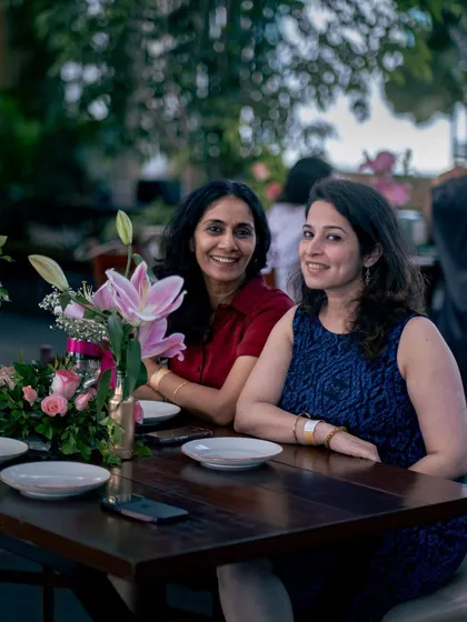Two guests enjoying a quiet moment at their table. My venue can accommodate both the energy of a large party and the intimacy of a smaller one.