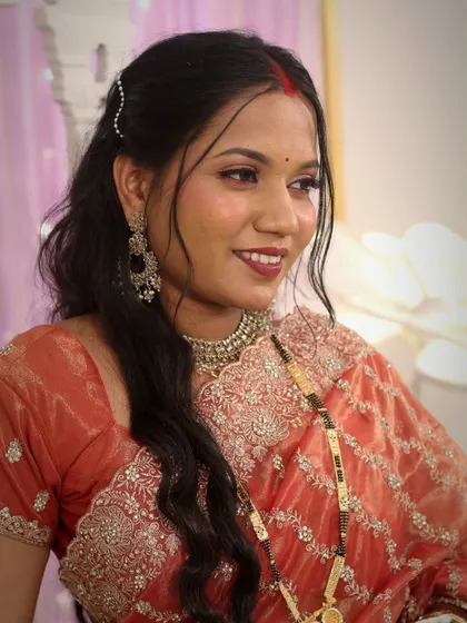 A classic portrait showcasing the bride's elegant makeup and hairstyle for her reception.