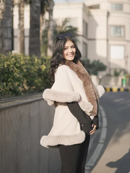 Another angle of the fur cape. It's a luxurious piece that can make any simple outfit look sophisticated.