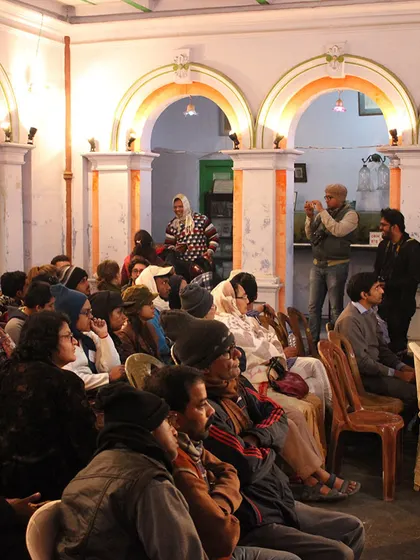 A community gathering inside a heritage house in Chandernagore. Our work often involves facilitating events that bring people together, using the inherent flexibility of traditional architecture to create spaces for dialogue and connection.