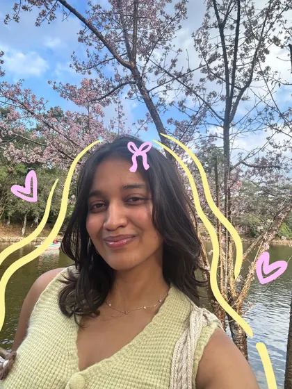A selfie by the lake, with some simple yellow doodles and pink hearts to add a soft, happy feel.