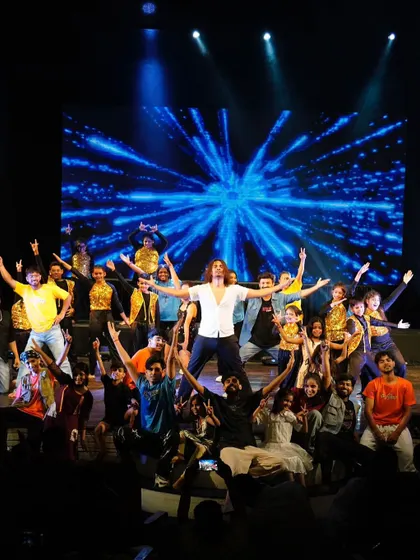 Another angle of our grand finale bow, capturing the joy and unity of our entire Zest 25 cast.