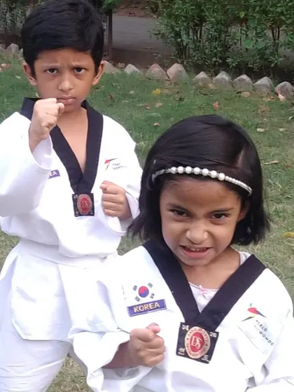 Two of my youngest students showing their fierce fighting faces. They are full of energy and potential.