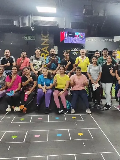 The heart and soul of my classes. Each photo captures a unique moment with my incredible community after a sweaty, joyful session. This is our shared victory lap.