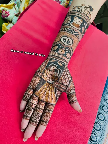A full-arm design for a baby shower. It combines a portrait of the parents with cute elements like a teddy bear, baby footprints, and elephants.