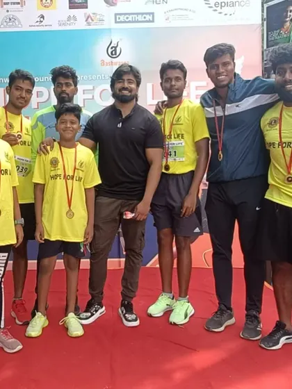 Celebrating with the team after the "Hope for Life" marathon. Everyone finished strong and earned their medals.