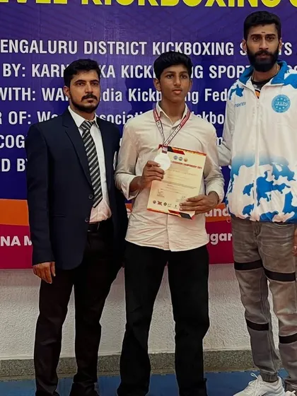 A proud moment with another one of my winning fighters at the state level championship.