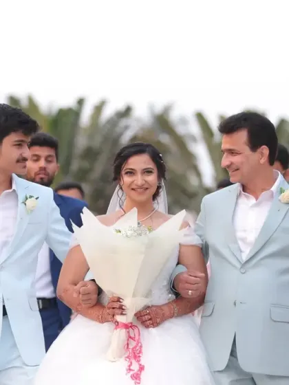 A heartwarming moment as the bride walks down the aisle for her Christian wedding. Her look is all about soft, romantic elegance, with a delicate updo and natural makeup that enhances her glow without overpowering her beautiful white gown.