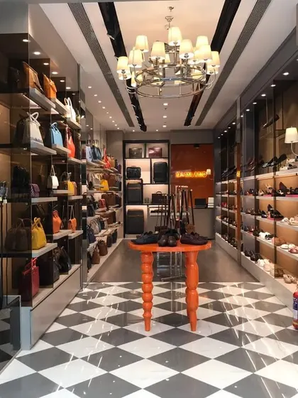 A view from the entrance of the 600 sq. ft. combined Da Milano and Rosso Brunello store in Hyderabad, showing the long, gallery-like layout.