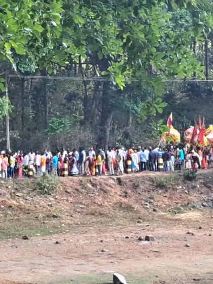 The procession winding its way along a lake, a beautiful but tense moment during my fieldwork.
