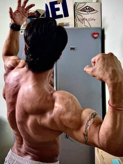 A dynamic back and arm pose, capturing the power and aesthetics of my upper body.