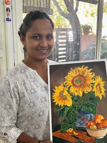 This student is all smiles with her beautiful still life painting of sunflowers. Our adult acrylic classes guide you from initial sketch to a finished, frame-worthy artwork.