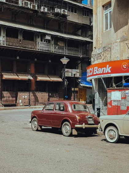 A vintage Fiat parked on a quiet side street, a common sight in old Bombay that always brings a smile to my face.