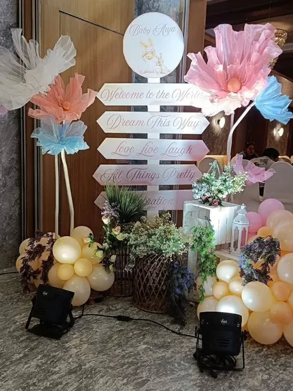 A detailed look at the whimsical entrance signpost, with directional signs like "Welcome to the world" and "Dream this way."