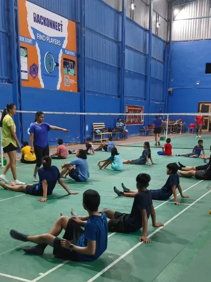 A coaching session in progress at our new Meerut academy. This image shows young players during a cool down stretch, highlighting the structured training programs we offer.