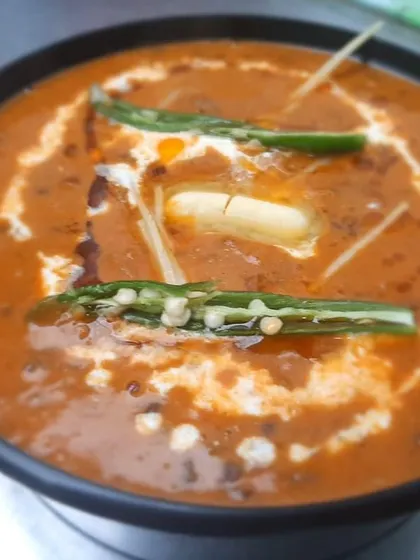 Our Dal Makhan Wali, also known as Dal Makhani, is rich, creamy, and topped with butter. It's the perfect comfort food for any meal.