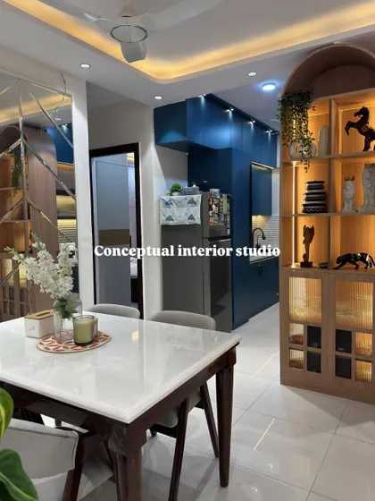 A closer look at the dining area, highlighting the beautiful arch-shaped wooden crockery unit with internal lighting to showcase decorative items.