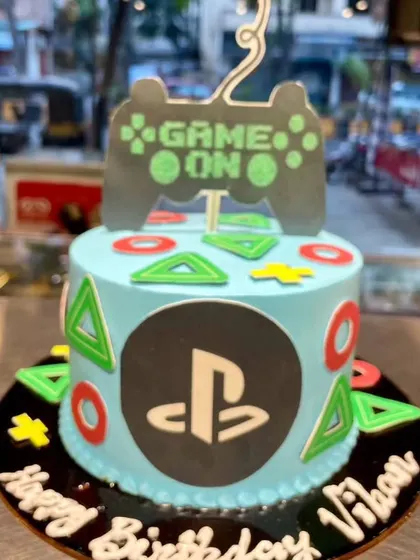 Game on. This PlayStation-themed cake is ideal for a gamer's birthday, featuring the iconic controller and button symbols.
