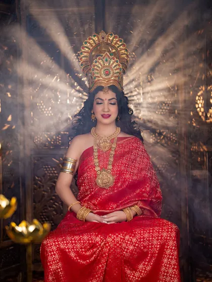 A serene and meditative pose. The makeup is designed to look beautiful even with eyes closed, showcasing the smooth application and rich color.